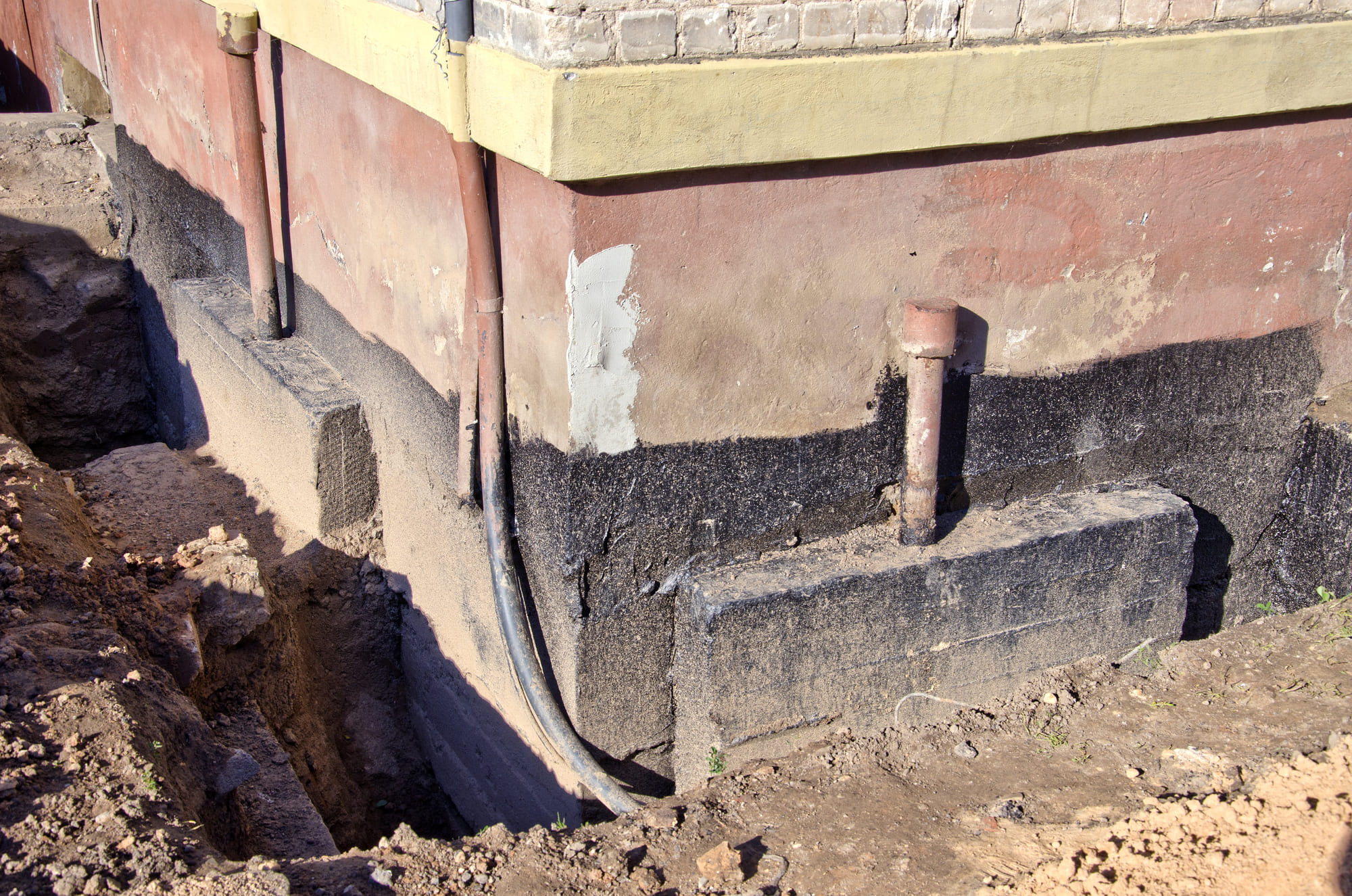 Image of the work site of a tunneling project being done to house as part of under slab foundation repair