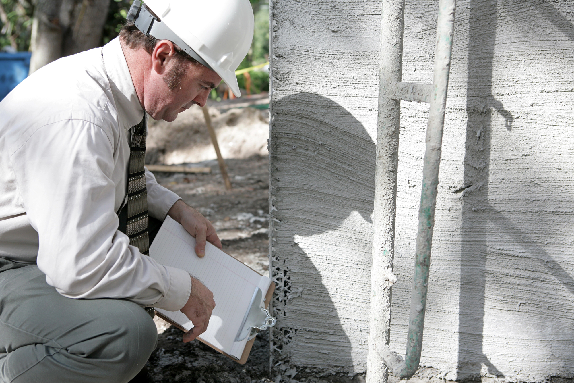 Building Inspector Checks Foundation